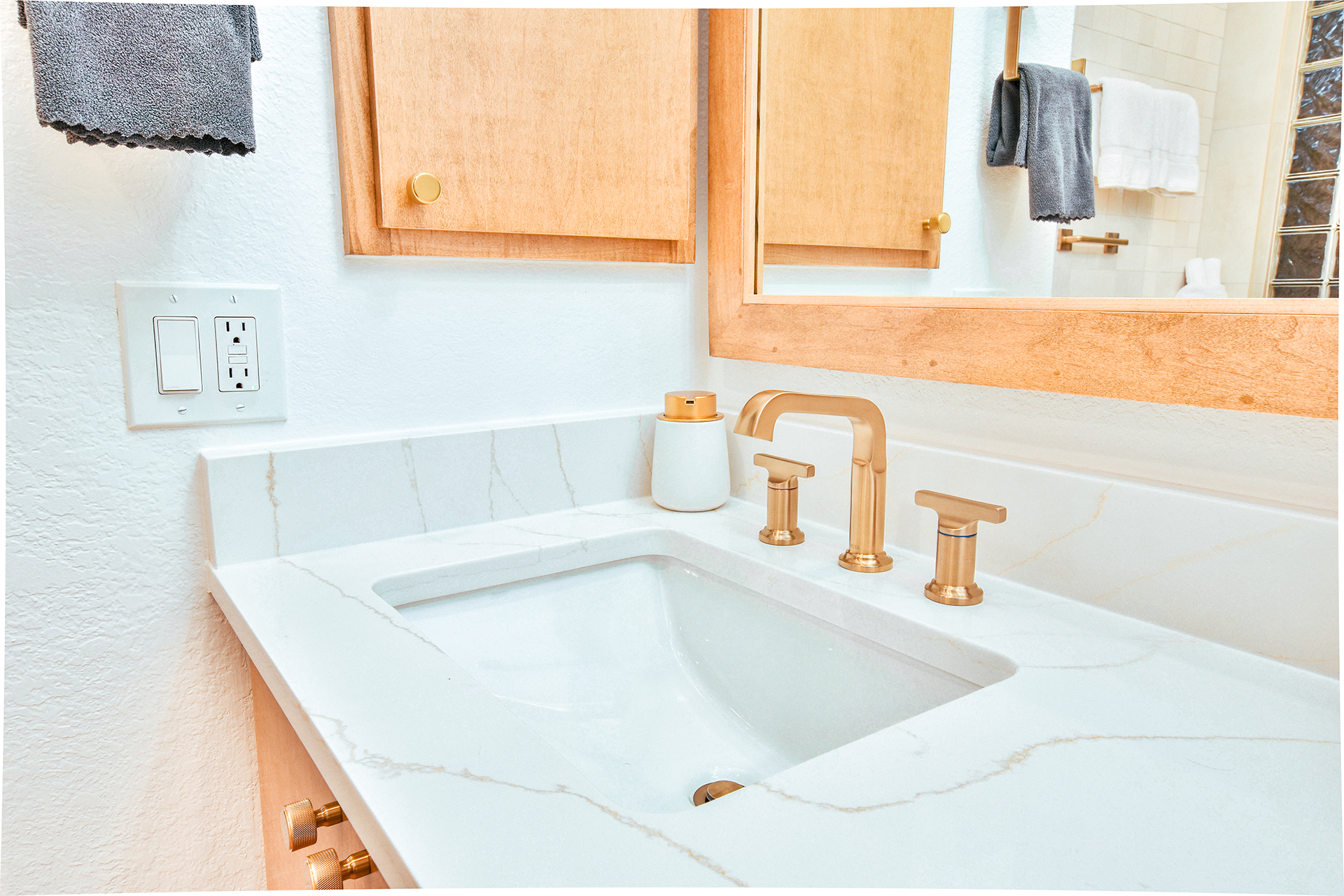 warm wood accents bathroom sink gold hardware remodel