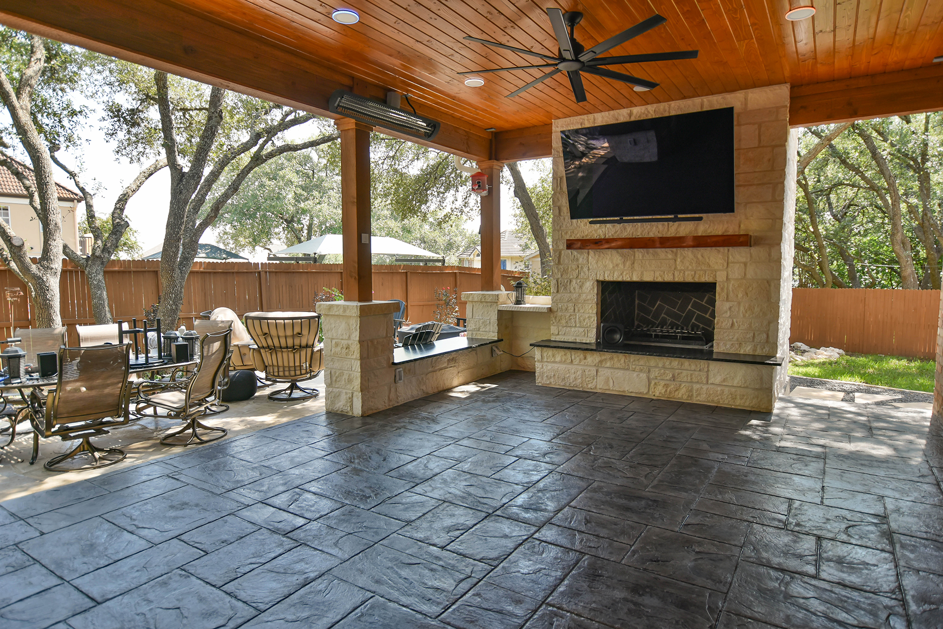 outdoor fireplace stone flooring wooden porch cover