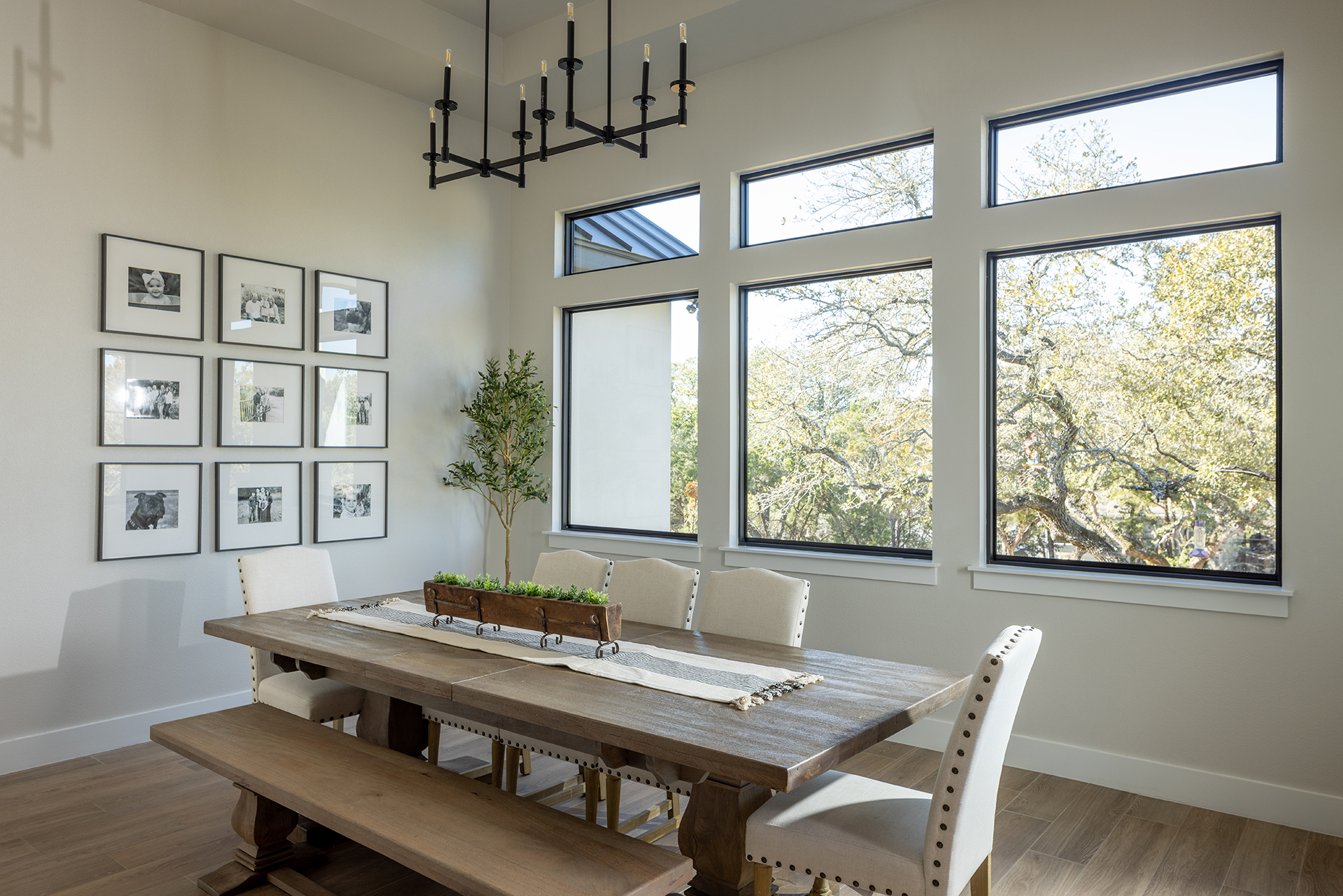 dining room large windows wood floor
