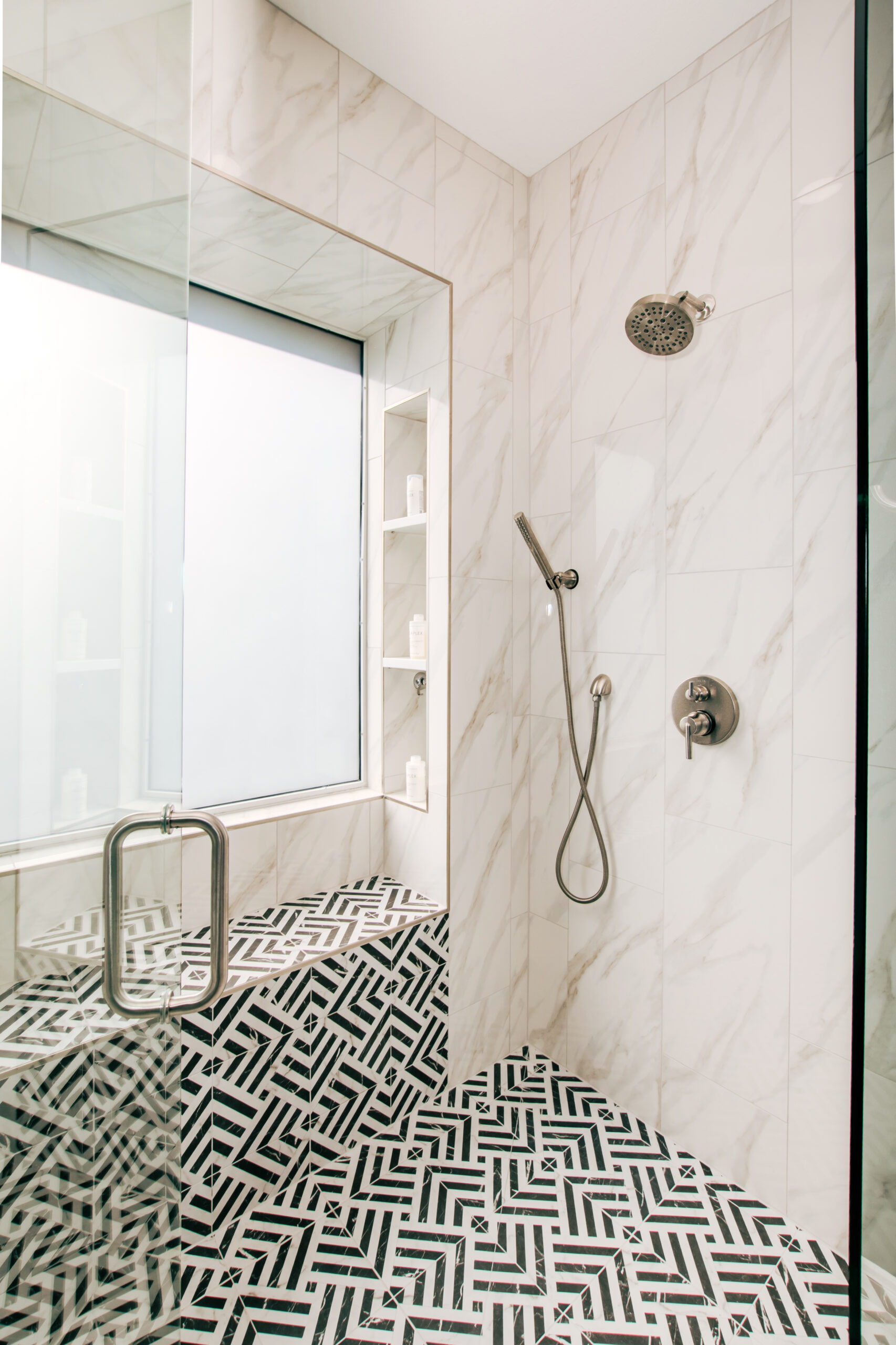 bold graphic tile black and white walk in shower bathroom remodel