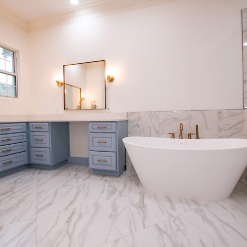 stone bathtub gold hardware bathroom remodel