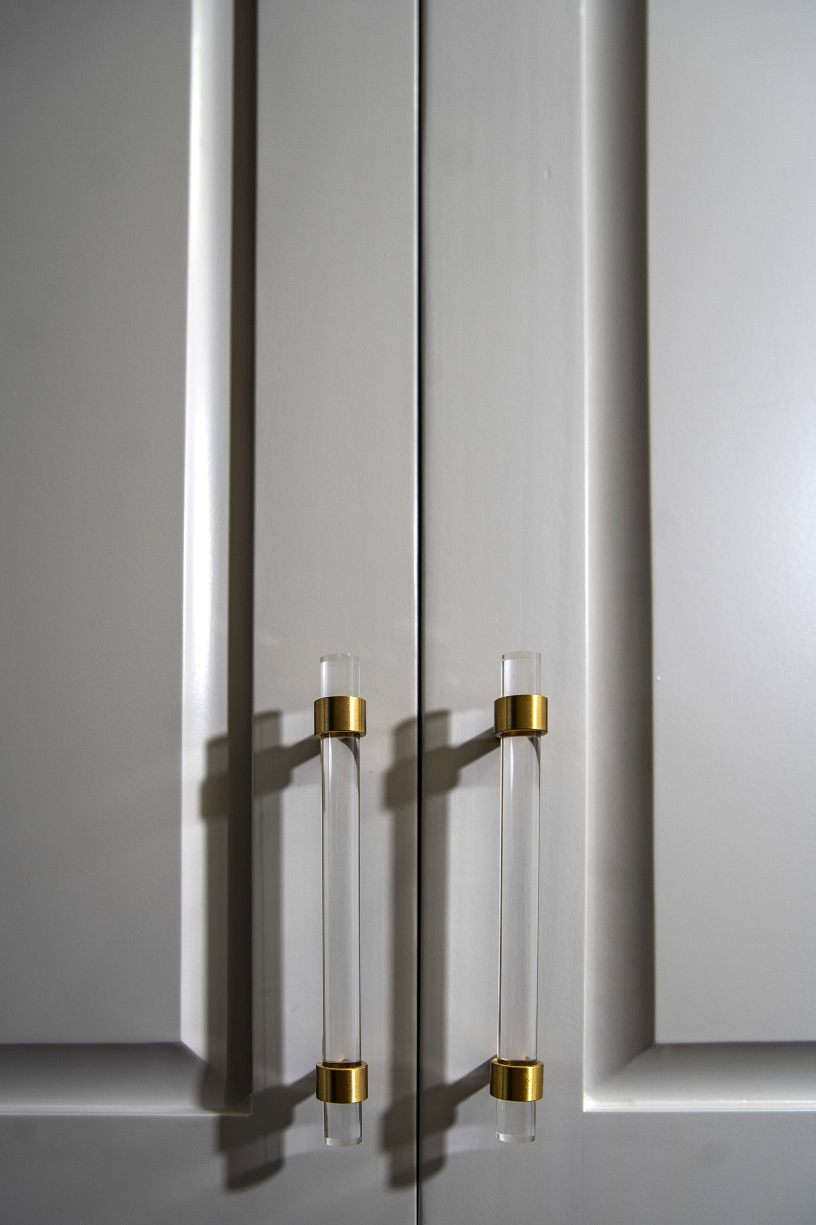 gold and clear pulls grey cabinet bathroom remodel