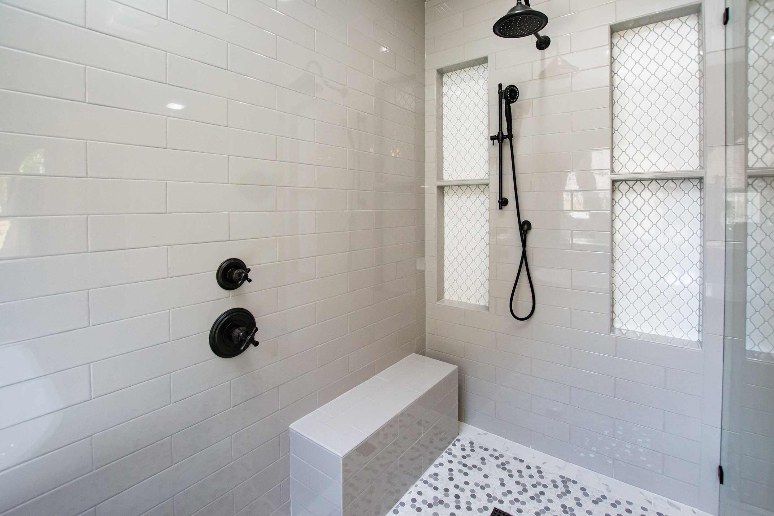 bathroom remodel shower tall niches tile bench